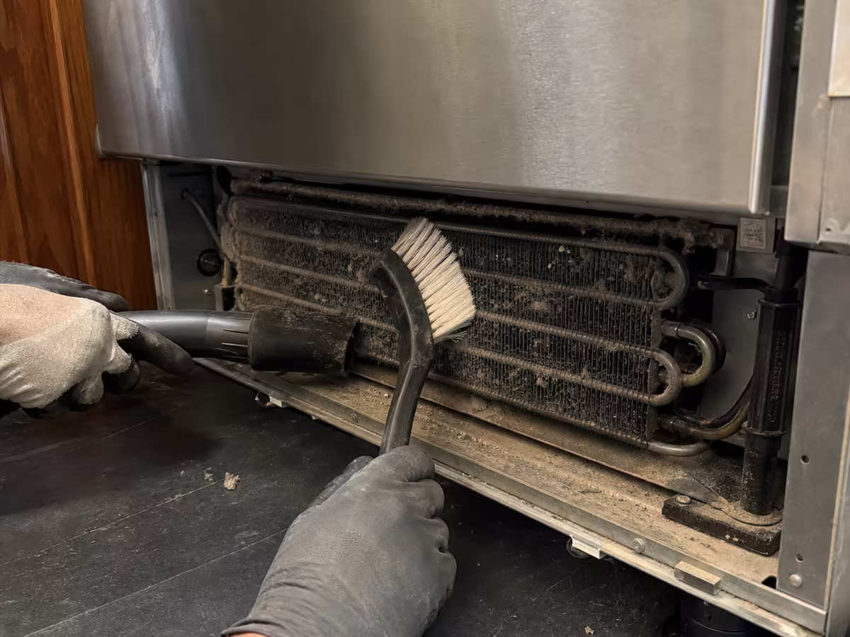 Dust-packed Sub-Zero condenser before cleaning in a Larkspur home