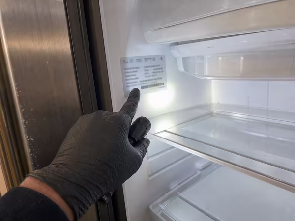 Small photo of a Sub-Zero model and serial tag on the interior cabinet wall
